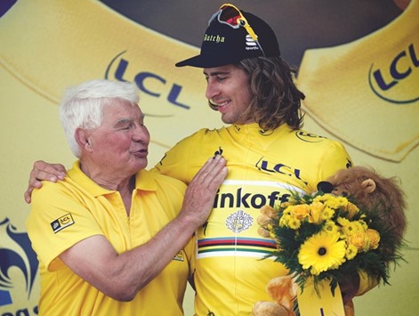 Tinkoff rider Peter Sagan of Slovakia (R) with former French cyclist Raymond Poulidor.