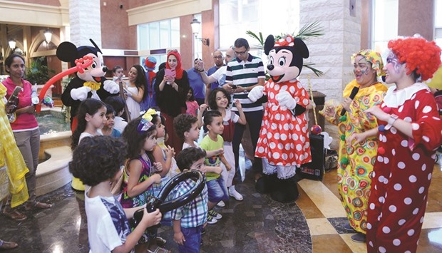 Mickey and Minnie Mouse, entertain children at Souq Al Medina in The Pearl-Qatar.