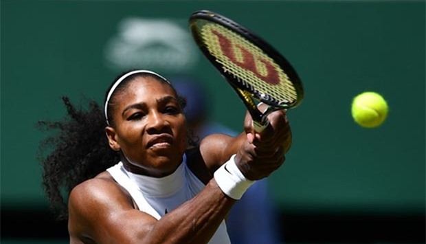Serena Williams returns to Russia's Elena Vesnina during their women's semi-final at the Wimbledon on Thursday.