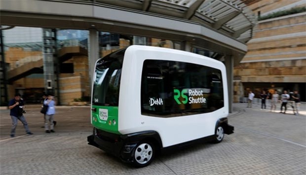 Japan's internet commerce and mobile games provider DeNA Co's Robot Shuttle, a driverless, self-driving bus, is seen during its demonstration in Tokyo on Thursday.