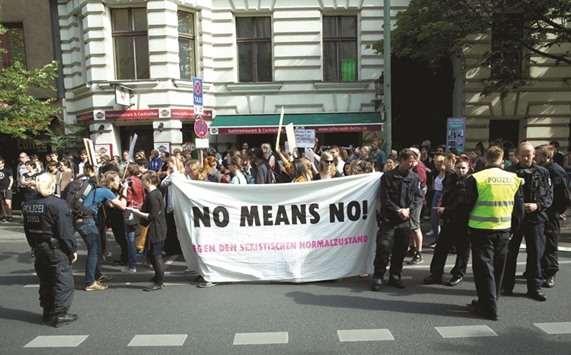 A photo taken on June 27 in Berlin shows people demonstrating against sexual violence.