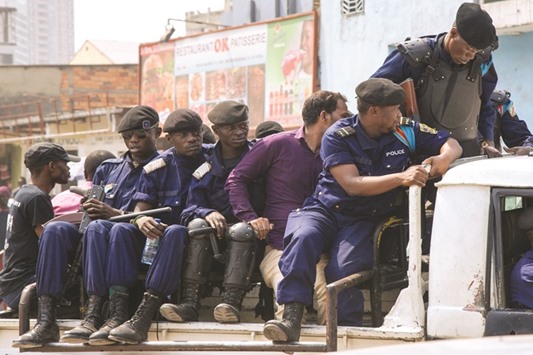 A businessman of Indian origin is evacuated yesterday by the police in the Ngaba district in Kinshasa.