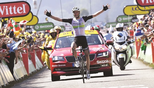 Great Britainu2019s Stephen Cummings celebrates as he crosses the finish line at the end of the 162,5km seventh stage of the 103rd edition of the Tour de France cycling race between Lu2019Isle-Jourdain and Lac de Payolle yesterday. (AFP)