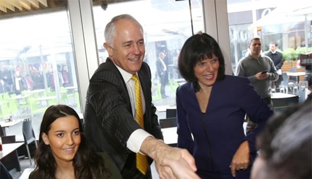 Australian Prime Minister Malcolm Turnbull and Liberal candidate for the federal seat of Chisholm Julia Banks greet locals during a street walk in Oakleigh, in Melbourne's southeastern suburbs, on Friday.