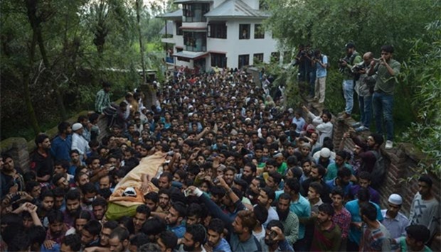 Kashmiri mourners carry the body of Burhan Muzaffar Wani, the new-age poster boy for the rebel movement in Jammu and Kashmir, ahead of his funeral in Tral, his native town, 42km south of Srinagar, on Saturday.