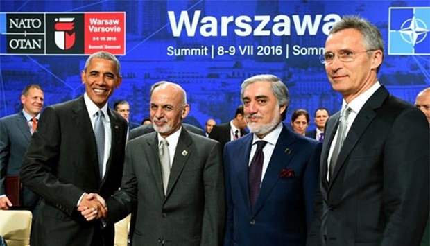 US President Barack Obama, his Afghan counterpart Ashraf Ghani, Afghan Chief Executive Abdullah Abdullah and Nato Secretary General Jens Stoltenberg pose for press during a Nato summit session on Afghanistan in Warsaw on Saturday.