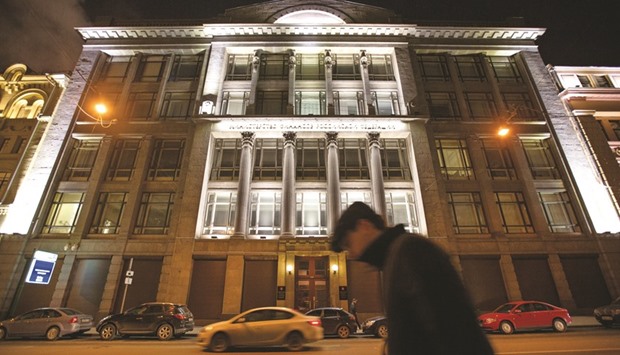 A pedestrian passes the headquarters of Russiau2019s ministry of finance in Moscow. The ministry is assessing a plan to reduce to zero Russiau2019s oil-export duty from 2018, while increasing the tax on crude extraction, according to government officials.