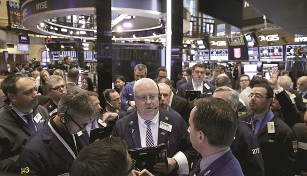 Traders work on the floor of the New York Stock Exchange (file). Capping two straight weeks of gains, the S&P 500 closed on Friday at 2,129.90 points, up 1.3% for the holiday-shortened stretch.