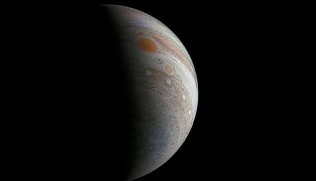 A crescent Jupiter and the Great Red Spot created by a citizen scientist (Roman Tkachenko) using data from Juno's JunoCam instrument, taken on December 11, 2016 at 2:30 p.m. PST, as the Juno spacecraft performed its third close flyby of Jupiter