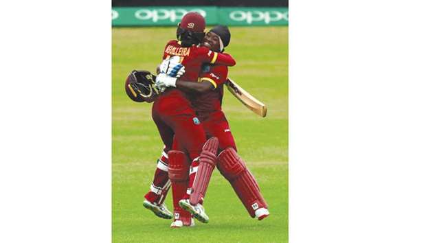 West Indiesu2019 Deandra Dottin (right) celebrates with Merissa Aguilleira after scoring a  century during the Womenu2019s World Cup match against Pakistan in Leicester. (Reuters)