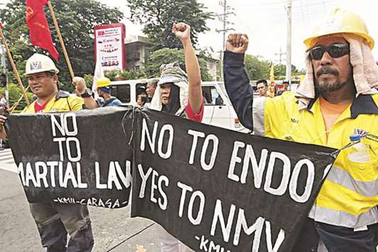 Workers from Caraga region hold a rally in Mendiola, Manila to protest the practice of contractualisation in the region.