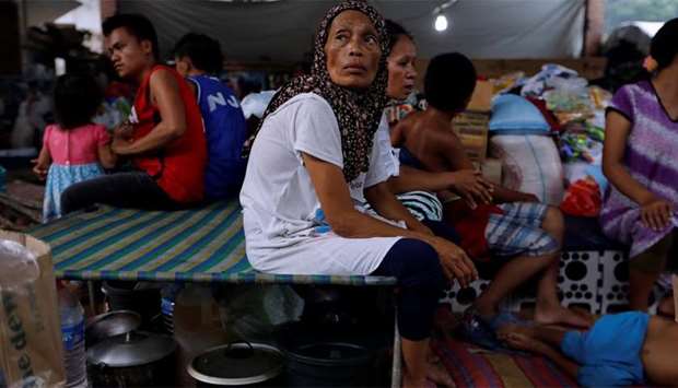 Evacuated Marawi residents rest at an evacuation centre in Iligan