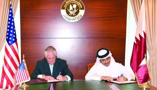 HE the Foreign Minister Sheikh Mohamed bin Abdulrahman al-Thani and US Secretary of State Rex Tillerson signing the agreement on combating terrorism financing in Doha on Tuesday.