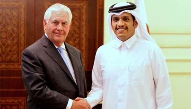 Foreign Minister HE Sheikh Mohamed bin Abdulrahman al-Thani shakes hands with US Secretary of State Rex Tillerson following a joint news conference in Doha on Tuesday.