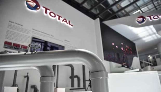 Models of oil pipes are seen at the Total stand at 22nd World Petroleum Congress in Istanbul.