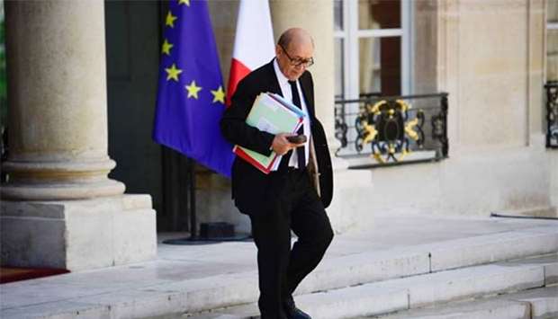 French Foreign Minister Jean-Yves Le Drian leaves the Elysee palace after the weekly cabinet meeting in Paris on Wednesday.