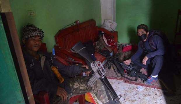 Militant members of the Maute group, an ISIS-affiliated group, inside a house in Marawi. File picture