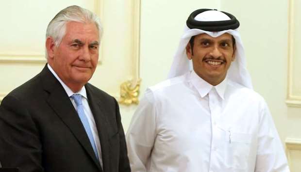 HE the Foreign Minister Sheikh Mohammed bin Abdulrahman Al-Thani  and US Secretary of State Rex Tillerson and leave the stage following a press conference in Doha. July 11, 2017 file picture.
