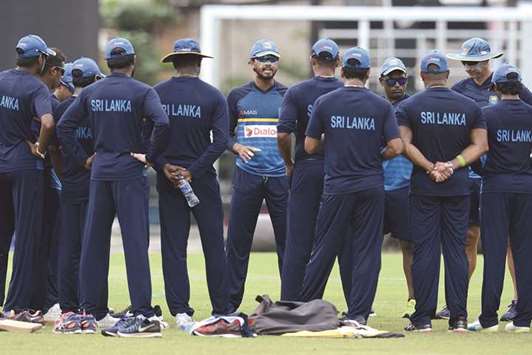 Sri Lankau2019s new Test captain Dinesh Chandimal (centre) chats with players during a practice session at the R Premadasa Cricket Stadium in Colombo. (AFP)