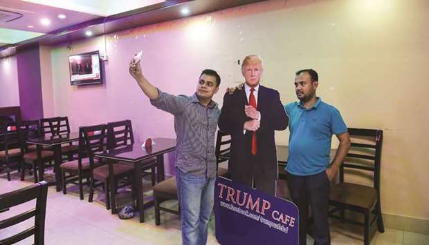 Customers take selfie with a cutout US President Donald Trump at the Trump Cafe in Dhaka yesterday.