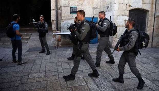Israeli border guards patrol in Jerusalem's Old City on Friday following an attack.
