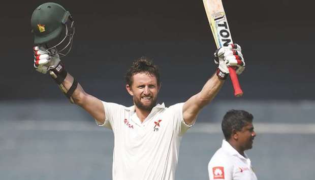 Craig Ervine celebrates after scoring a century  against Sri Lanka at the R Premadasa Cricket Stadium in Colombo yesterday.