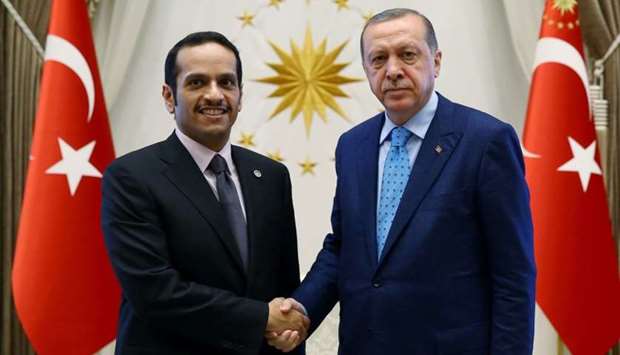 HE the Foreign Minister Sheikh Mohamed bin Abdulrahman al-Thani  (L) shaking hands with Turkey's President Recep Tayyip Erdogan  at the presidential palace in Ankara.