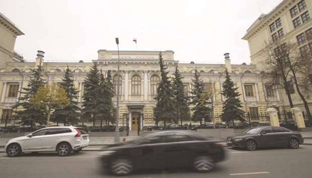 Vehicles pass in front of the headquarters of Russiau2019s central bank in Moscow. The withdrawal of the big three firms will leave ACRA, a new Kremlin-backed ratings agency promoted by the central bank, and Expert RA, a veteran of Russiau2019s domestic rating industry, as the only agencies able to assess Russian debt.