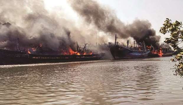 Smoke rises yesterday from the blaze of traditional fishing boats in Pati, Central Java province.