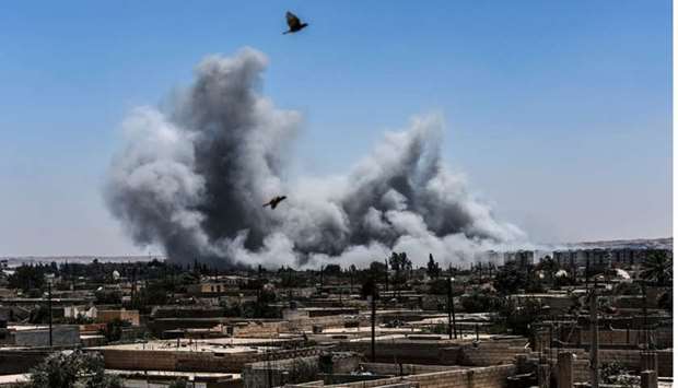 Smoke billows following an airstrike on the western frontline of Raqqa on July 15, 2017, during an offensive by the Syrian Democratic Forces (SDF), an alliance of Kurdish and Arab fighters, to retake the city from Islamic State (IS) group fighters