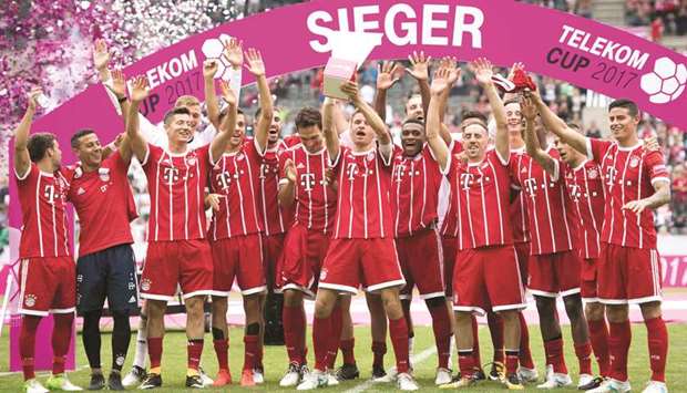 Bayern Munich players celebrate after beating Werder Bremen 2-0 on Saturday to win a pre-season four-team tournament in Moenchengladbach, Germany. (AFP)