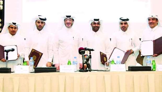 Al-Kaabi with representatives of the five Qatari property developers after Monday's signing ceremony of the deal for the construction of hotels and hotel apartment complexes inside the Ras Bufontas Special Economic Zone.