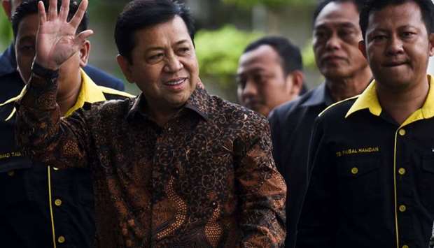 The speaker of Indonesia's parliament Setya Novanto waves as he arrives at Corruption Eradication Commision building (KPK) in Jakarta, Indonesia, July 14, 2017.