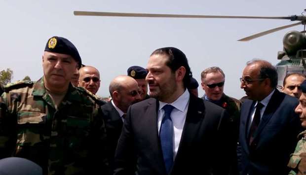 Lebanese Prime Minister Saad al-Hariri arrives with Army Commander General Joseph Aoun (L) at the United Nations Interim Force in Lebanon (UNIFIL) headquarters in Naqoura, near the Lebanese-Israeli border, southern Lebanon on April 21, 2017