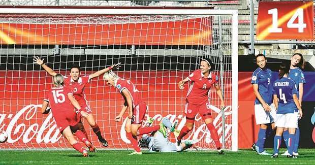 Russiau2019s midfielder Elena Morozova (3rd L) celebrates with teammates after scoring during the UEFA Womenu2019s Euro 2017 match between Italy and Russia at Stadium Sparta Rotterdam in Rotterdam.