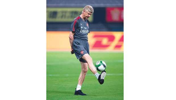 Arsenal coach Arsene Wenger attends a training session.