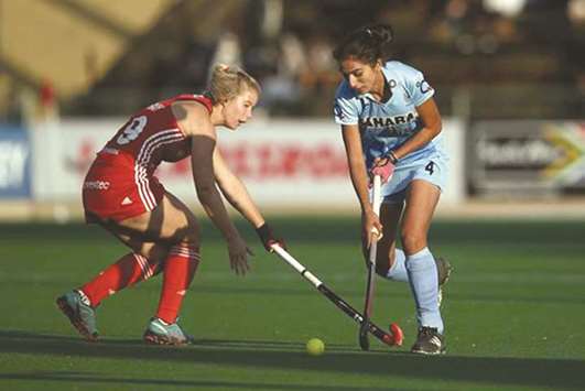 England and India players vying for the ball during the HWL semi-final.