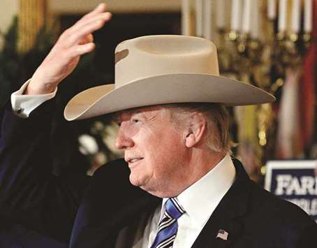 President Trump examines US-made products from all 50 states, including a Stetson brand hat.