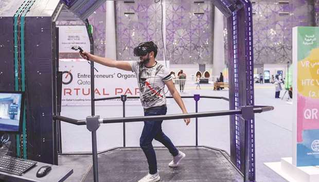 An adult tries out the rides at the VR Park.