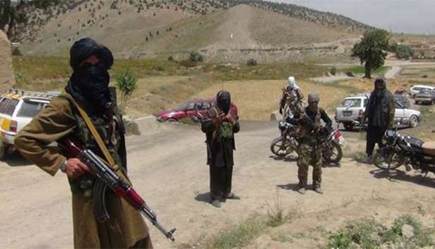 Fighters with Afghanistan's Taliban militia stand with their weapons in Ahmad Aba district on the outskirts of Gardez, the capital of Paktia province.