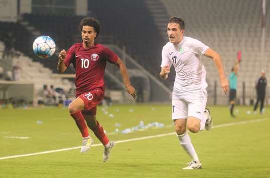 Qataru2019s Akram Afif (left) in action during his teamu2019s 2018 AFC U-23 Championship qualification match against Turkmenistan yesterday. PICTURE: Jayan Orma