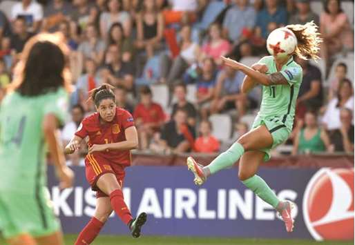 Vicky Losada (L) of Spain shoots past Tatiana Pinto (R) of Portugal during the UEFA Womenu2019s Euro 2017 football tournament match between Spain and Portugal at Stadion De Vijverberg yesterday.