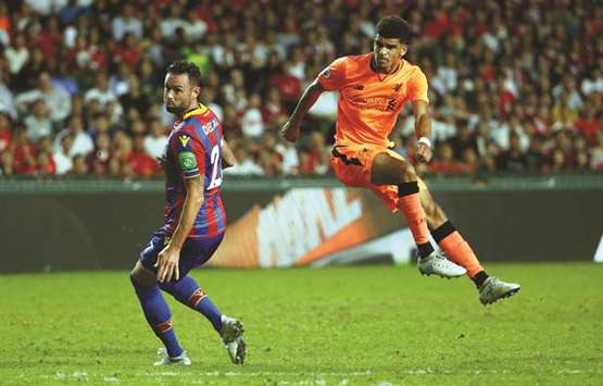 Liverpoolu2019s Dominic Solanke (right) scores against Crystal Palace during the Premier League Asia Trophy in Hong Kong yesterday.