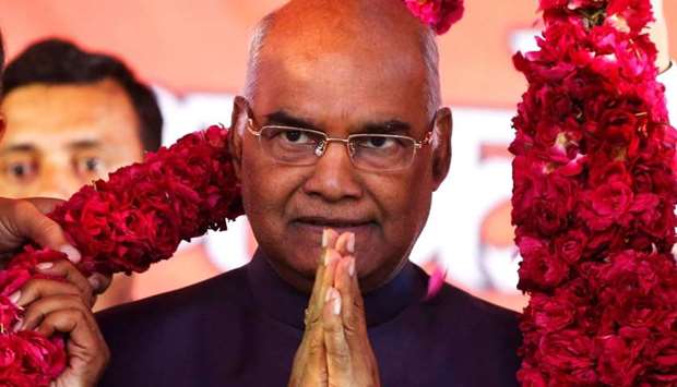 Supporters of Ram Nath Kovind present him with a garland during a welcoming ceremony as part of his nation-wide tour, in Ahmedabad. File picture, July 15, 2017