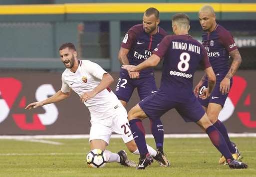 AS Roma's Maxime Gonalons (left) is brought down by Paris Saint-Germain defender Thiago Motta during a friendly match at Comerica Park in Detroit, Michigan on Wednesday. PSG edged Roma 5-3 on penalties after they played to a 1-1 draw in regulation time. (AFP)