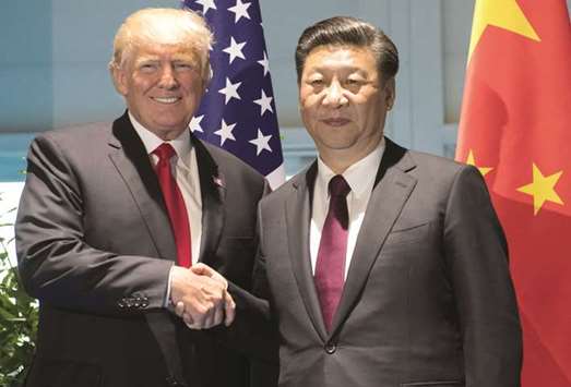 US President Donald Trump and Chinese President Xi Jinping (right) shake hands prior to a meeting on the sidelines of the G20 Summit in Hamburg, Germany (file). The annual economic dialogue session in Washington ended with cancelled news conferences, no joint statement and no new announcements on US market access to China.