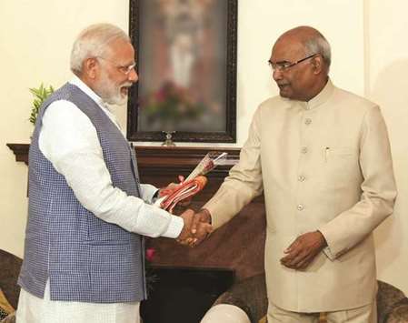 Prime Minister Narendra Modi congratulates president-elect Ram Nath Kovind in New Delhi yesterday.
