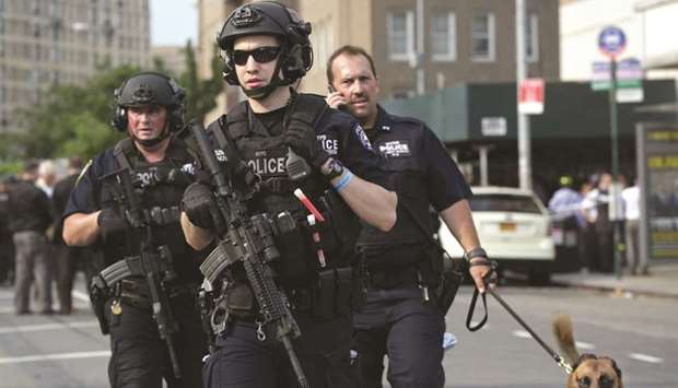 Police officers gather outside Bronx-Lebanon Hospital Center.