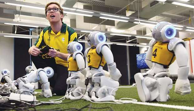 Soccer robots are prepared in Sydney yesterday.