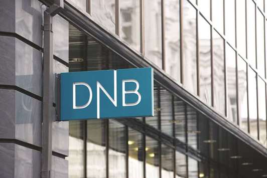 A DNB logo is displayed outside its branch in Vilnius, Lithuania. Norwayu2019s biggest bank is beefing up its asset management division after disgruntled institutional clients sent its national rankings to the lowest since 2013.